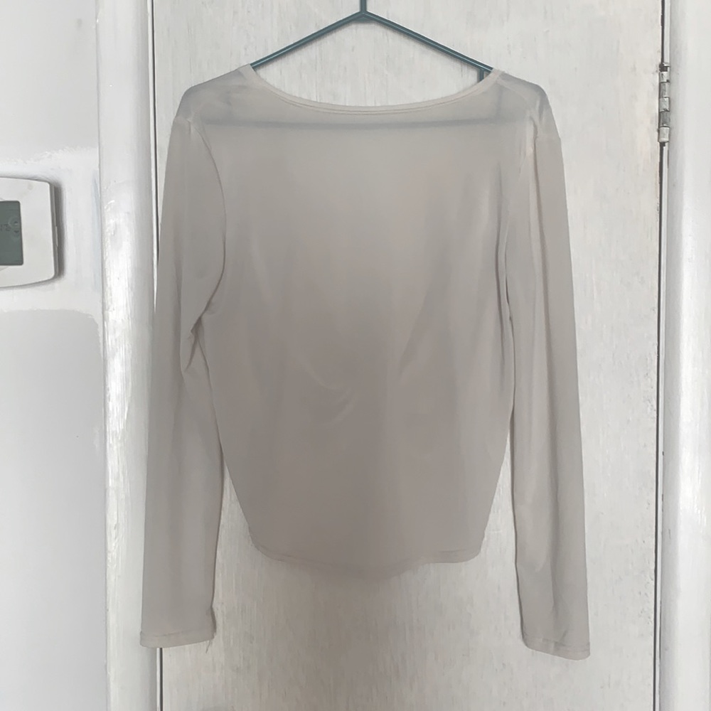 Swoop back long sleeve blouse